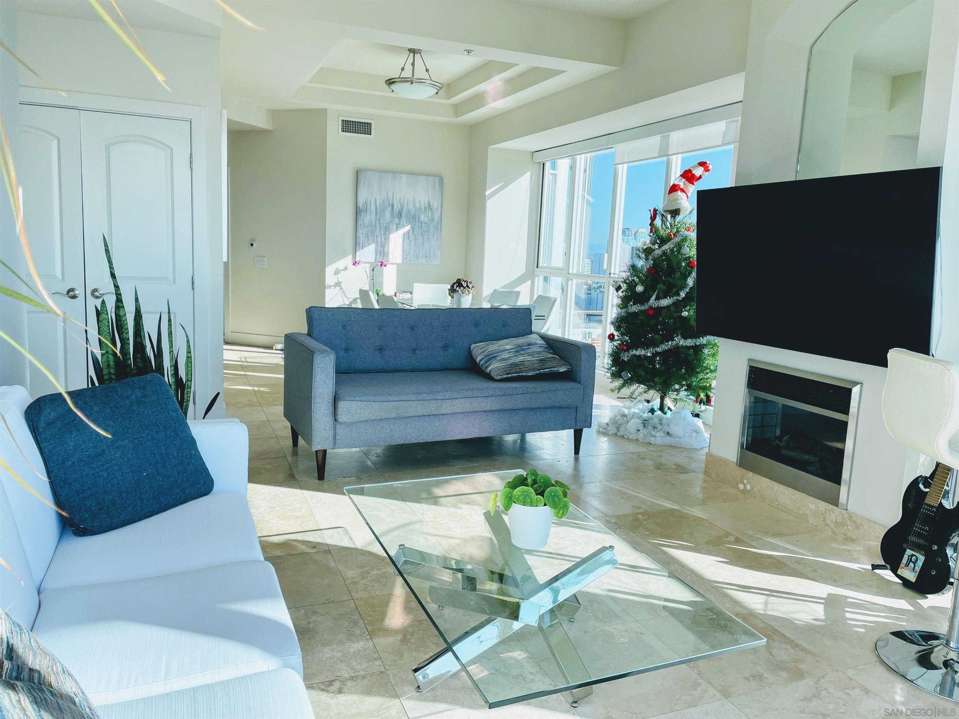 a living room with furniture and a flat screen tv