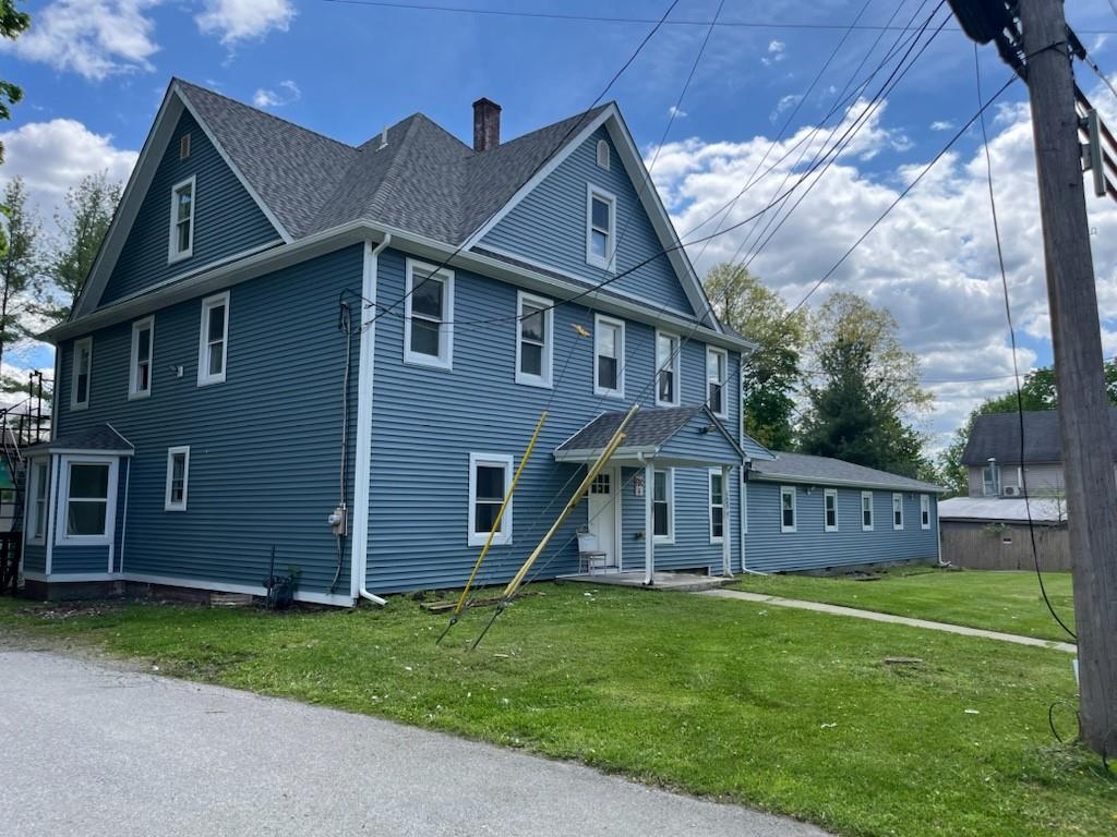 a view of a house with a yard