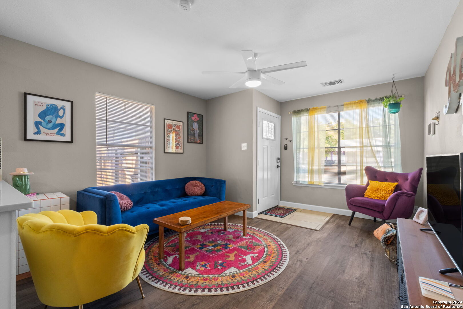 a living room with furniture and a window