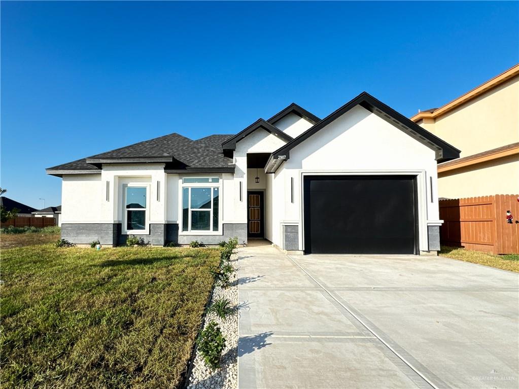 a house with yard in front of it