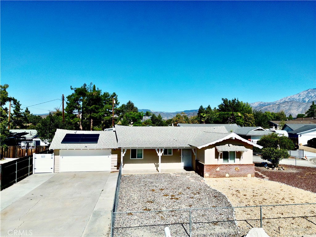 a view of house with yard outdoor seating and entertaining space