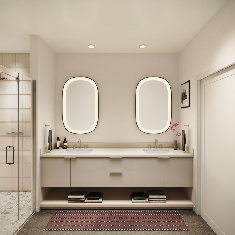 a bathroom with a double vanity sink and a mirror