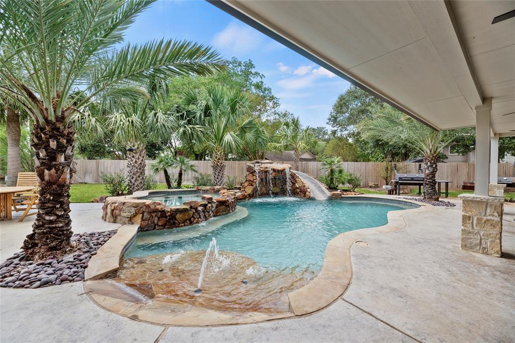 a view of a swimming pool with a sitting space