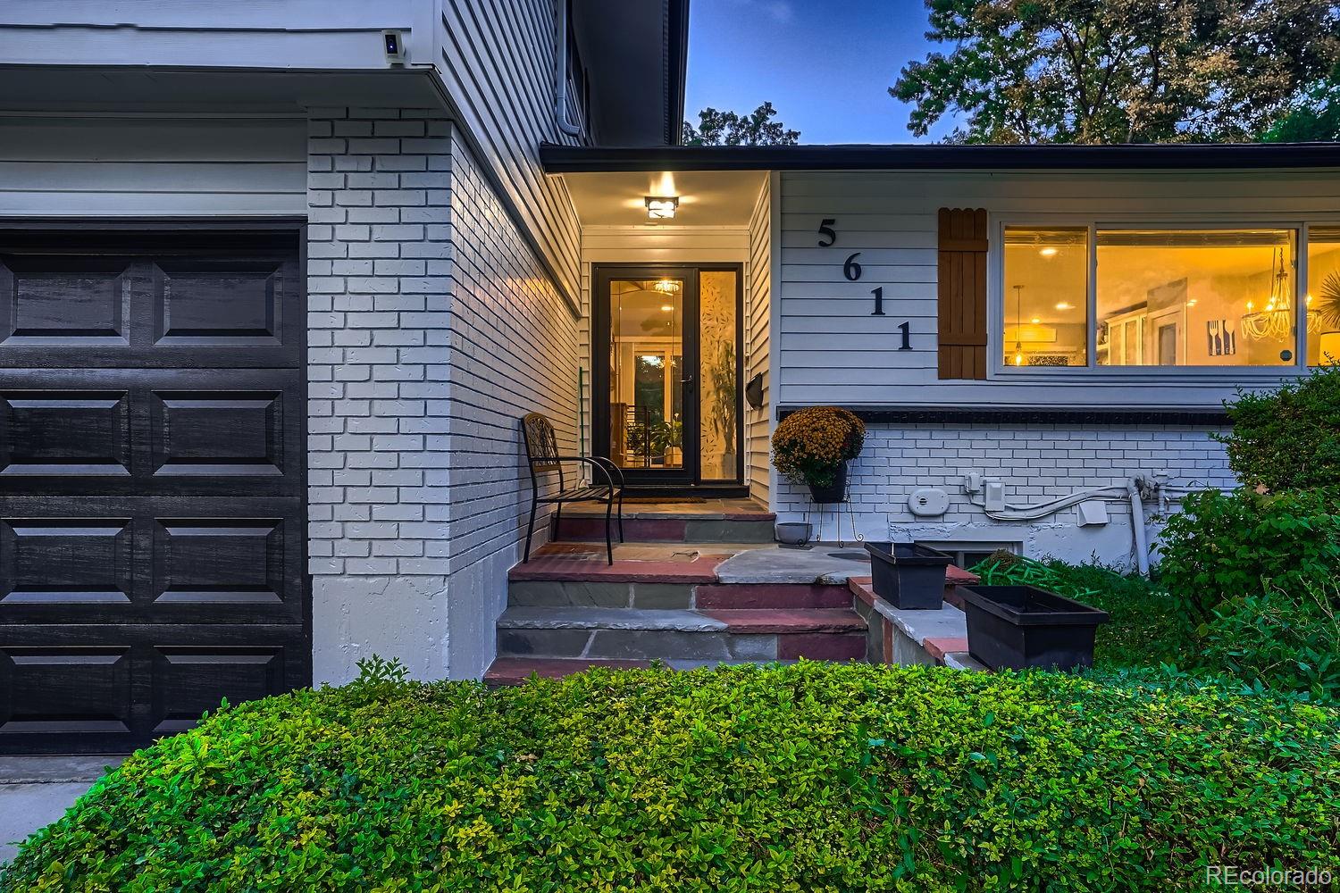 a view of front door and potted plants