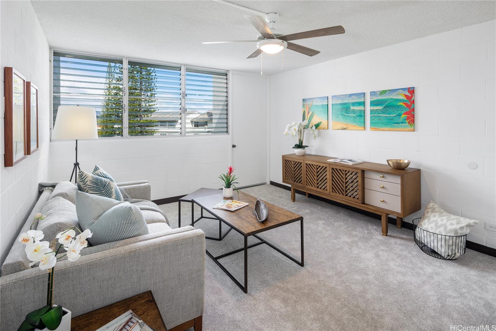 a living room with furniture and a window