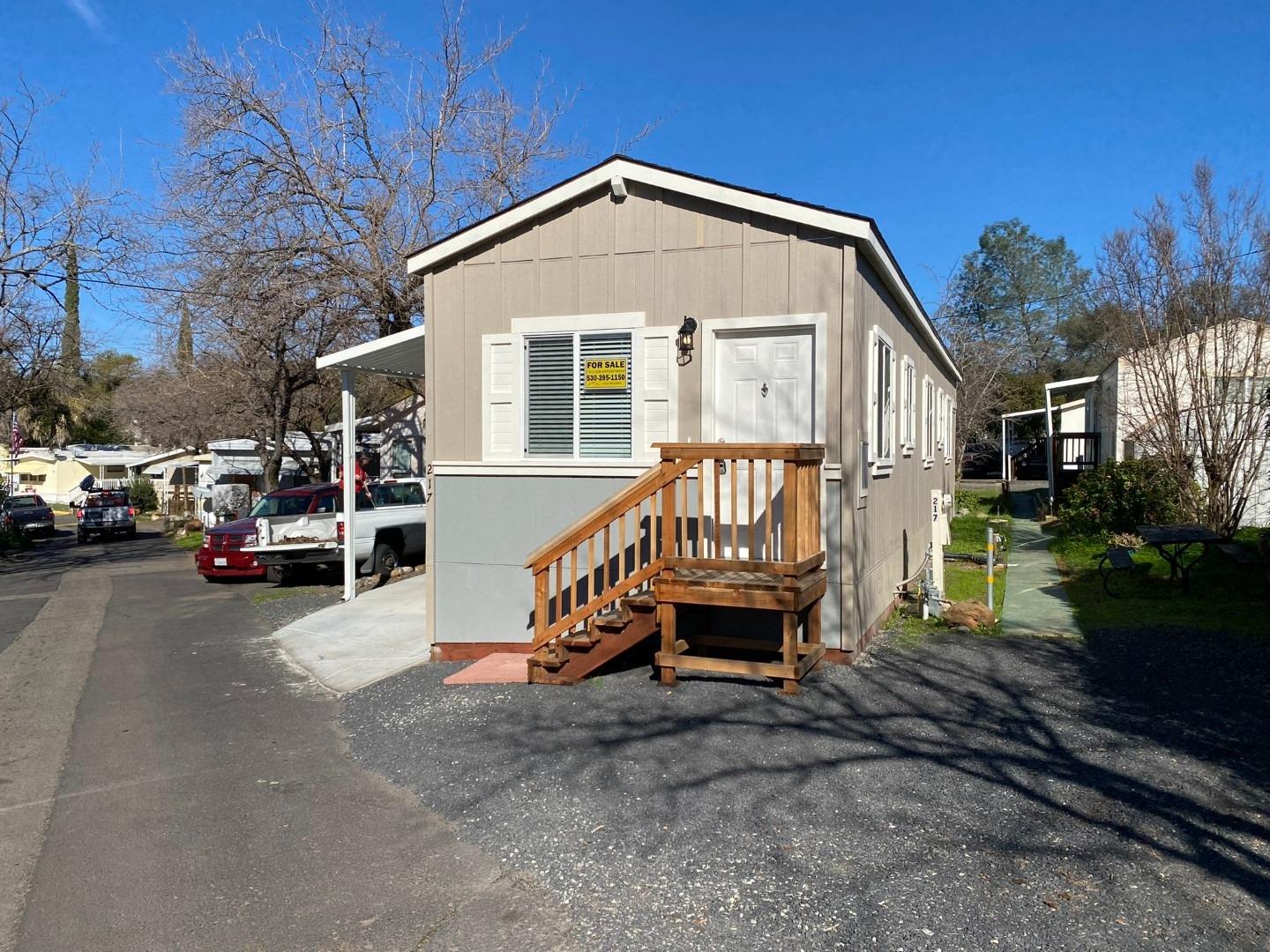 a view of a house with truck parked