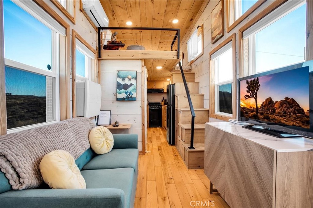 Living Room w/ Stairs to the loft