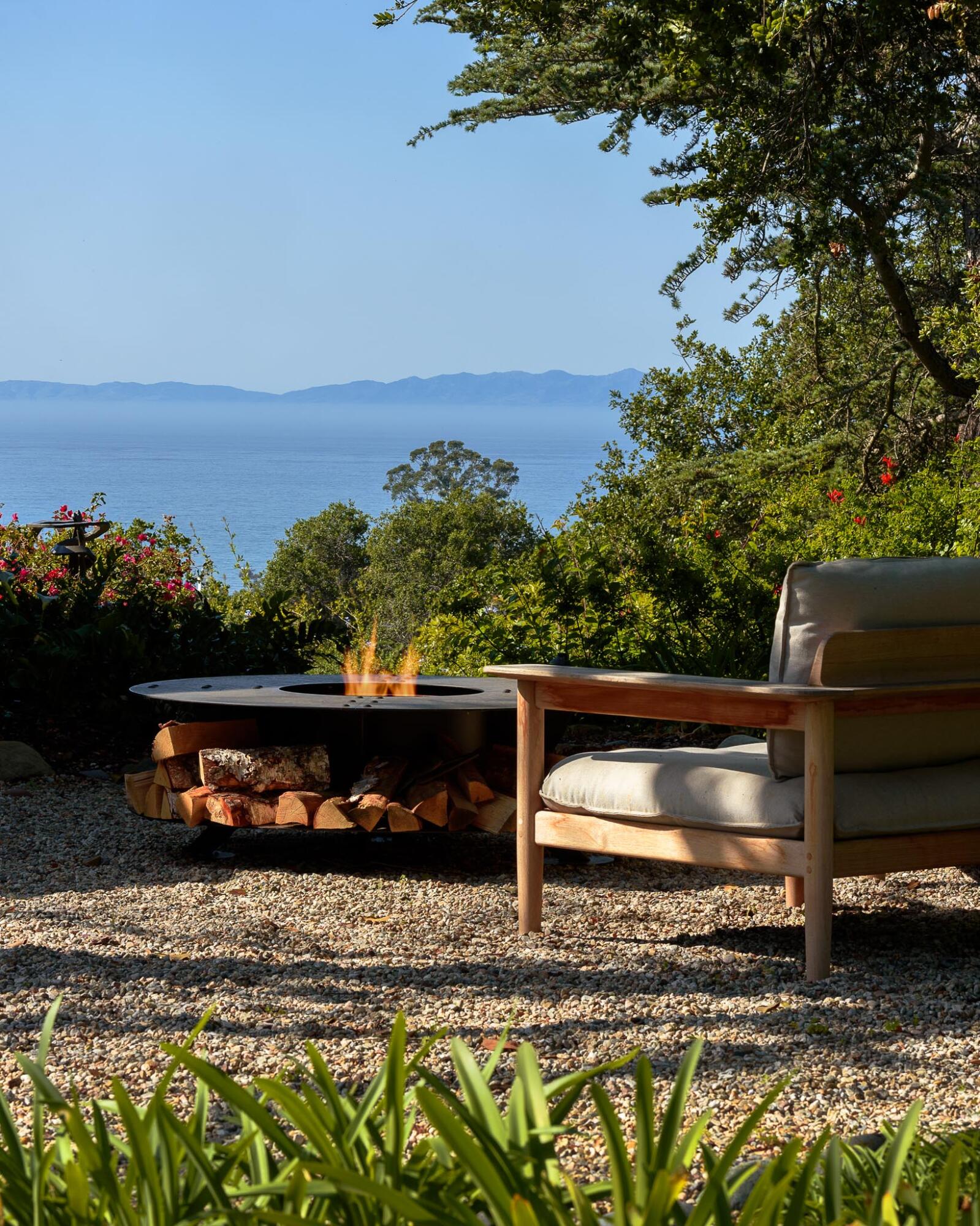 a view of a wooden bench sitting in the backyard