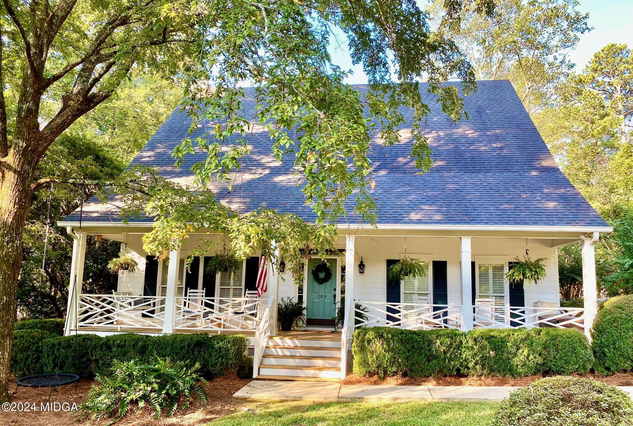 a view of a house with patio front of house