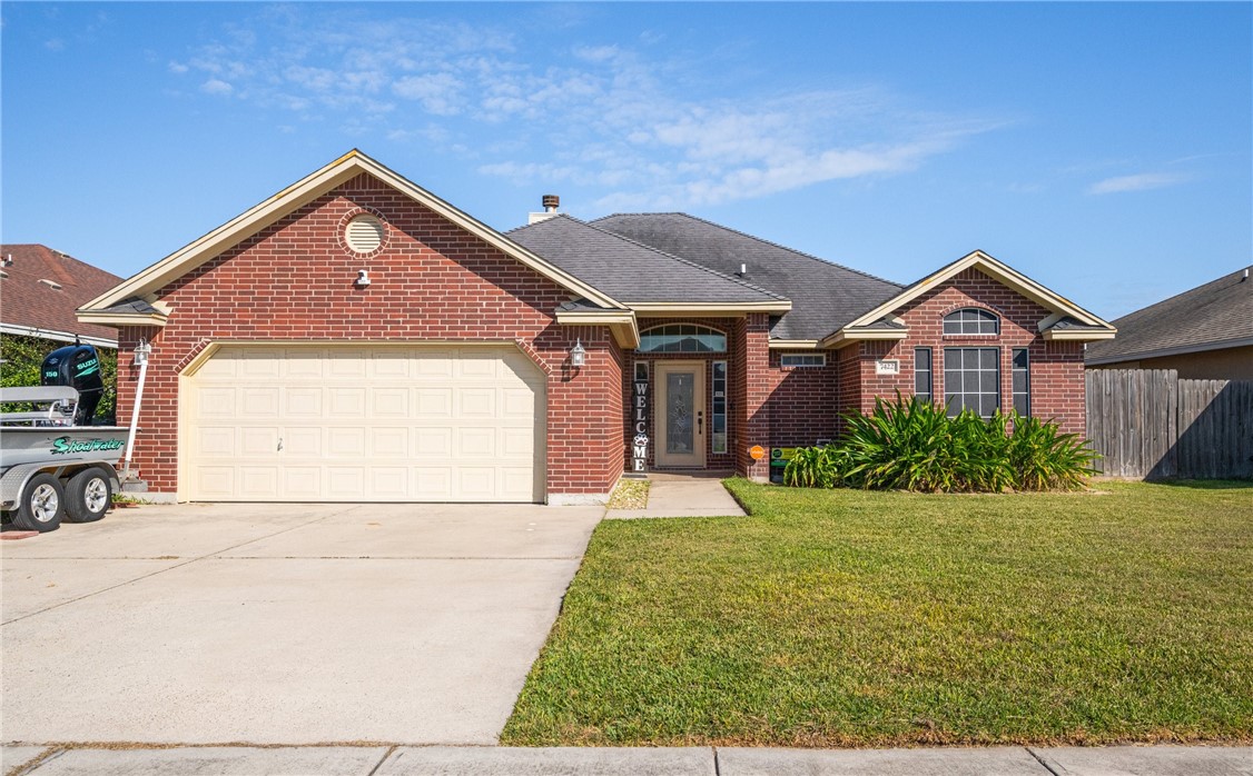 a front view of a house with yard