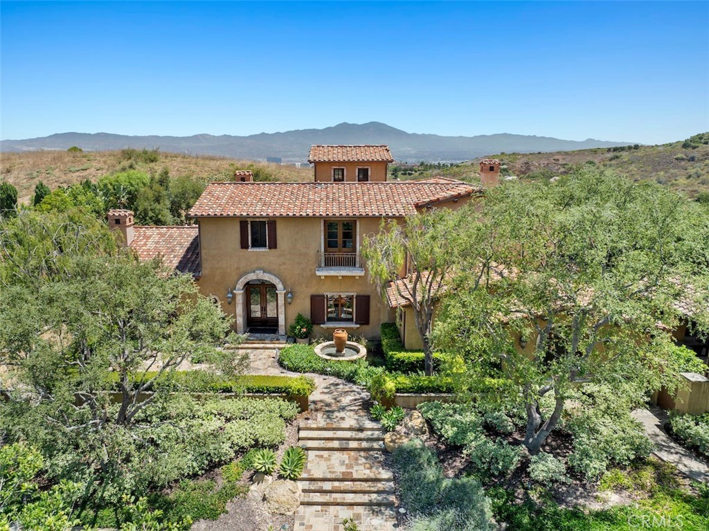 an aerial view of a house with a garden