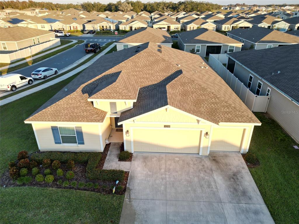 a view of a balcony with yard