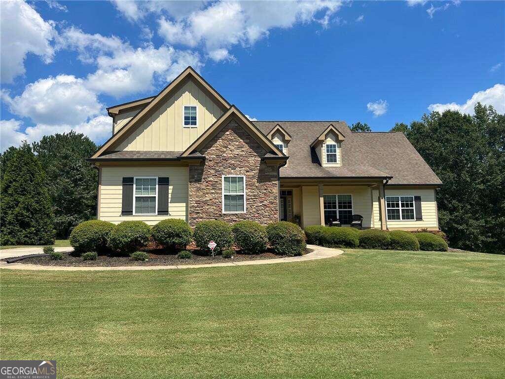 a front view of a house with a yard