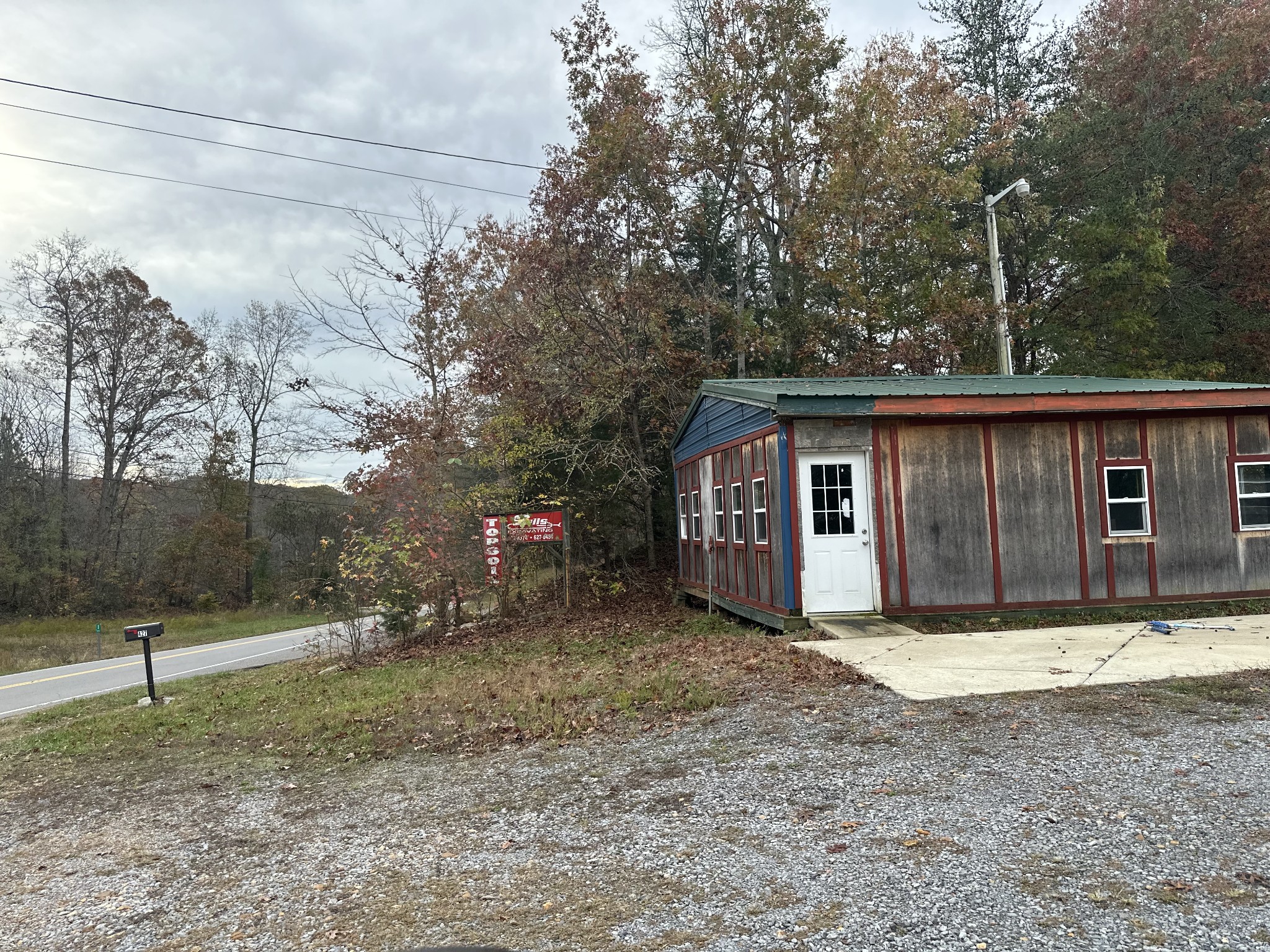 There’s a water meter in front of mail box. Do not drive over or on meter. Approximate 16 ft easement is by the red sign. Call agent for details.