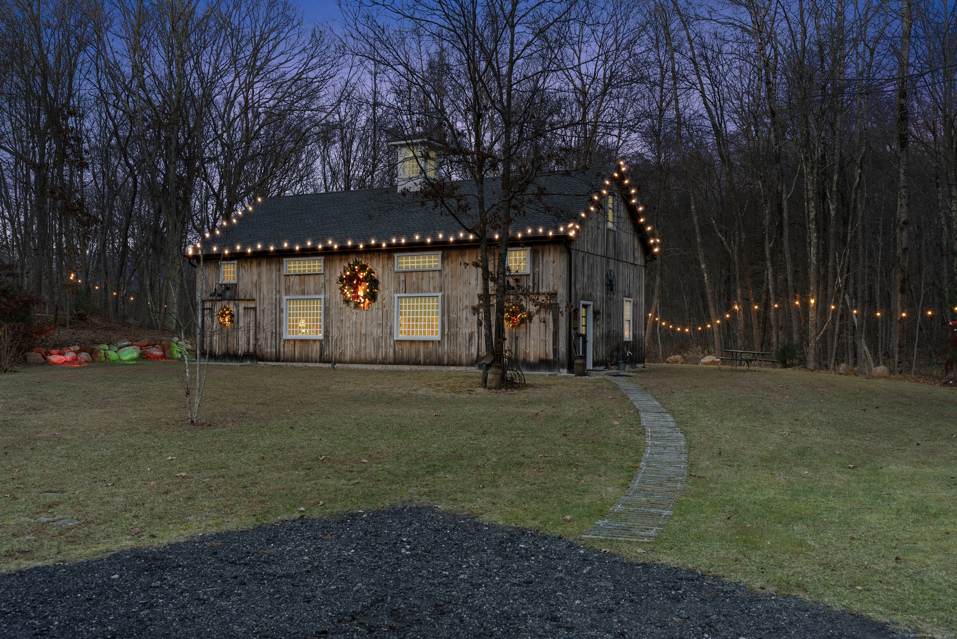 a view of a house with a yard and garage