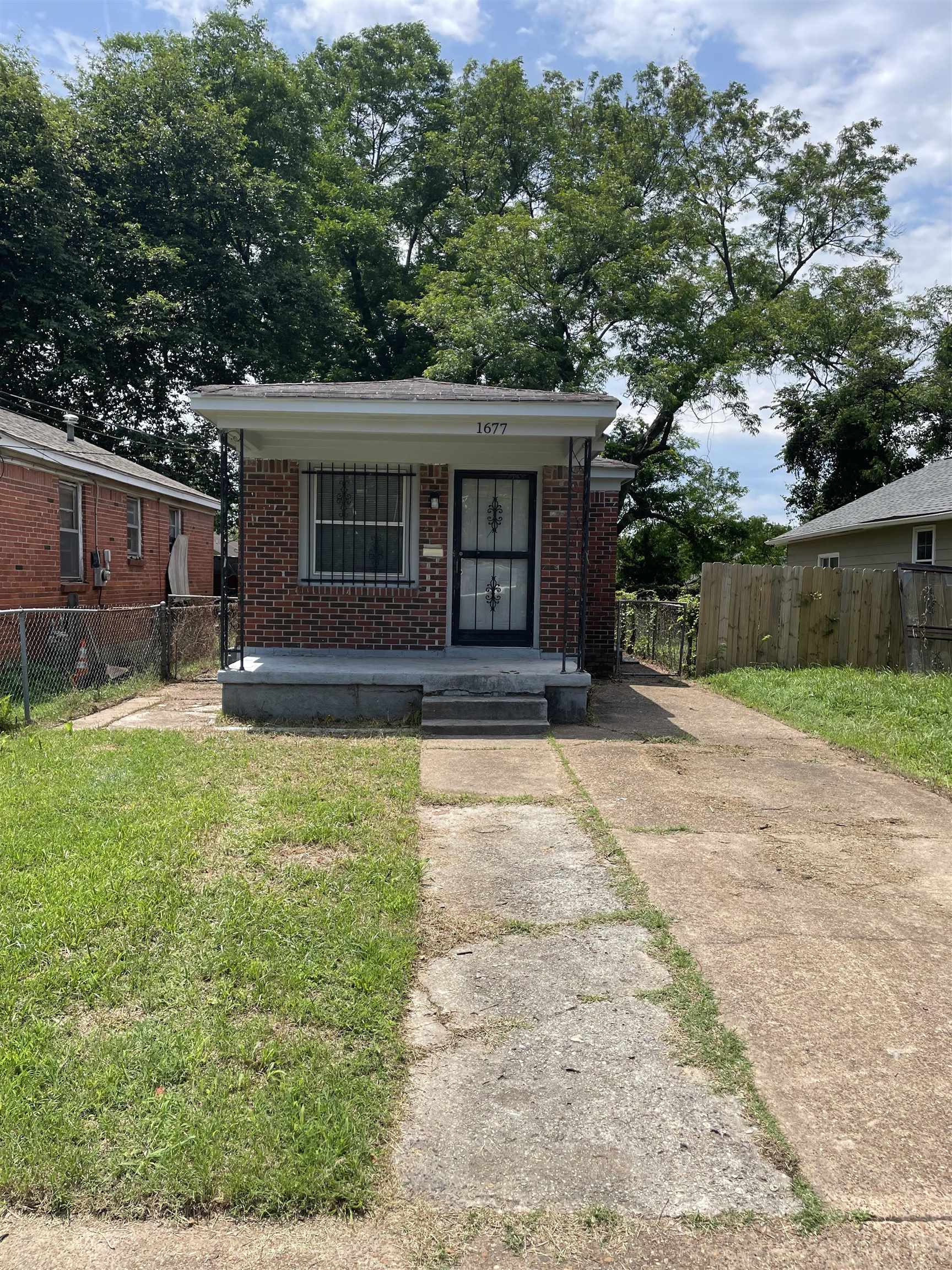 front view of a house with a yard