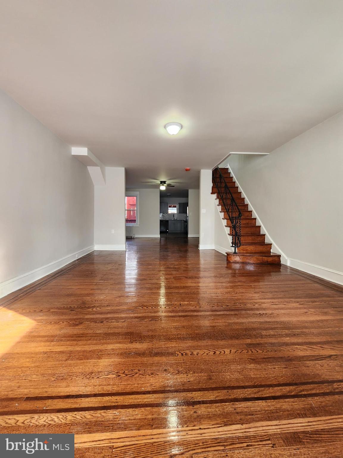 a view of a room with wooden floor