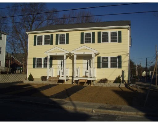 a front view of a house with outdoor space