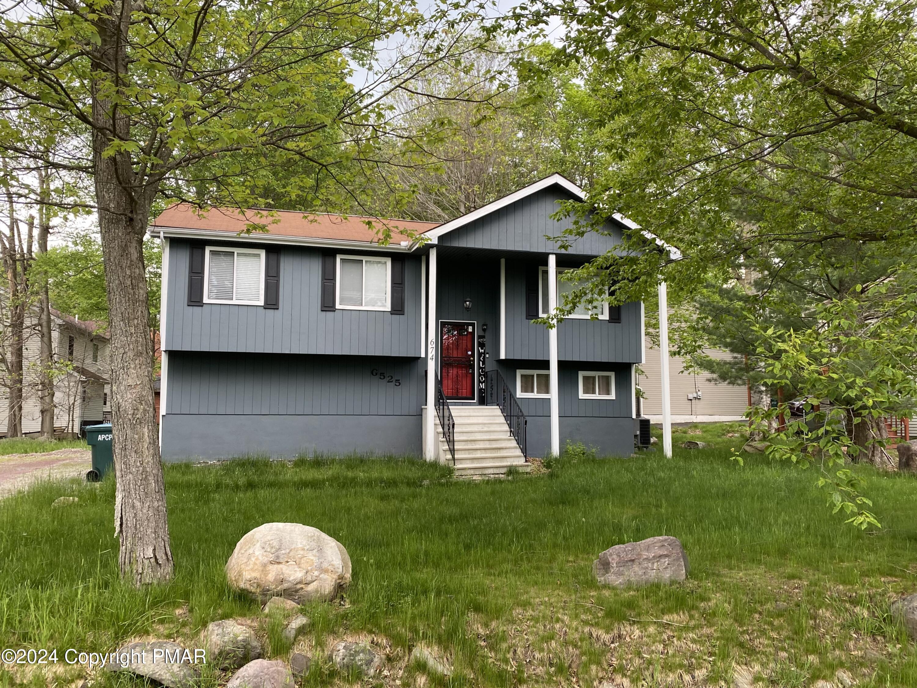 a front view of a house with yard