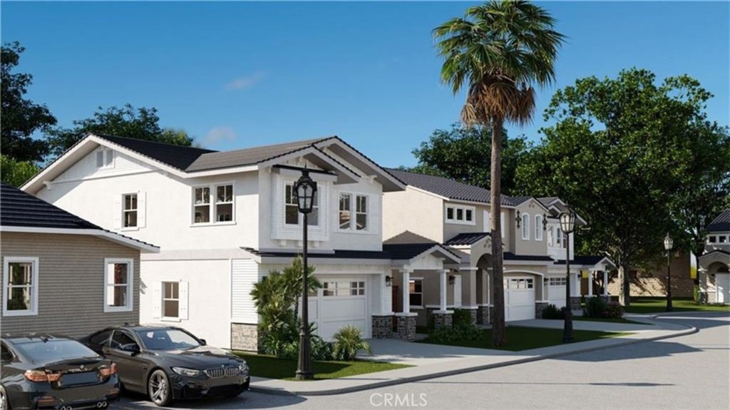 a front view of multiple houses with yard