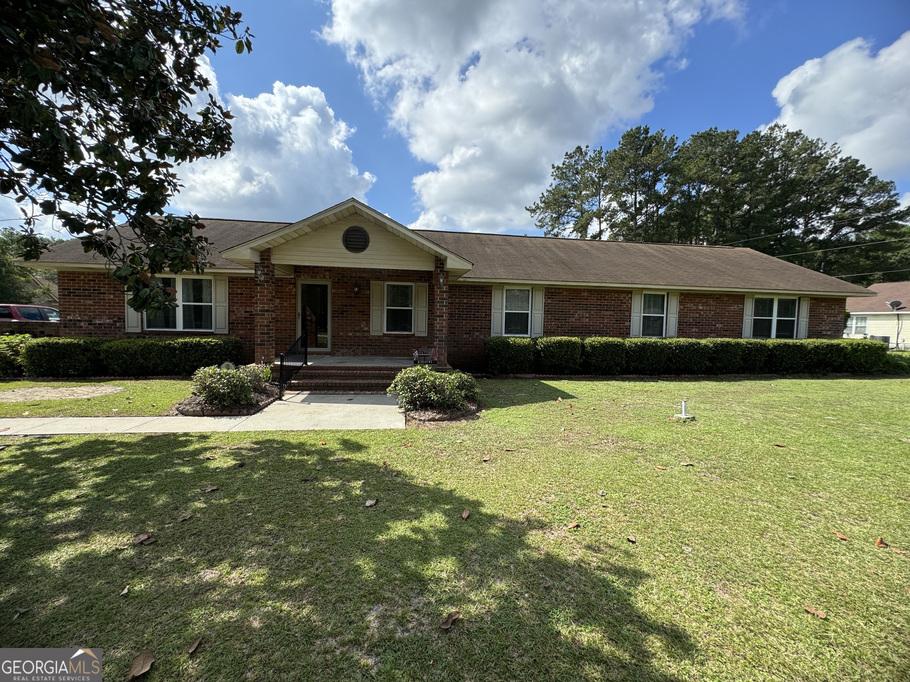 a front view of a house with a yard