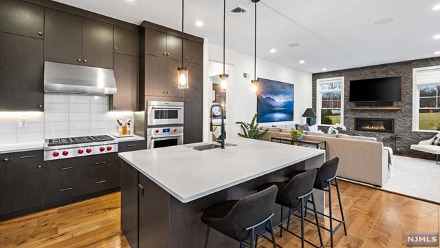 a large kitchen with a table and chairs