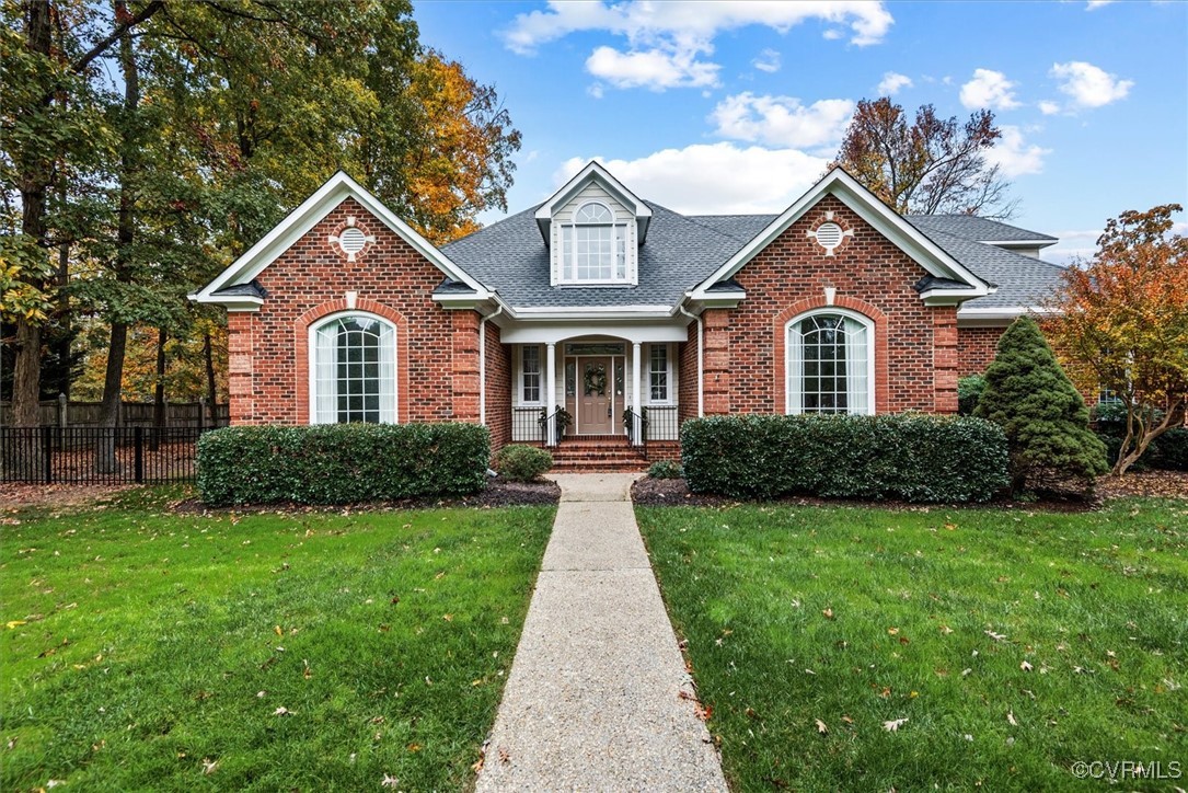 a front view of a house with yard