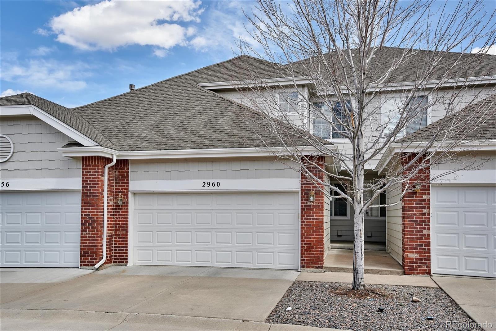 a front view of a house with a garage