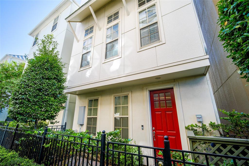 a front view of multi story residential apartment building with a yard