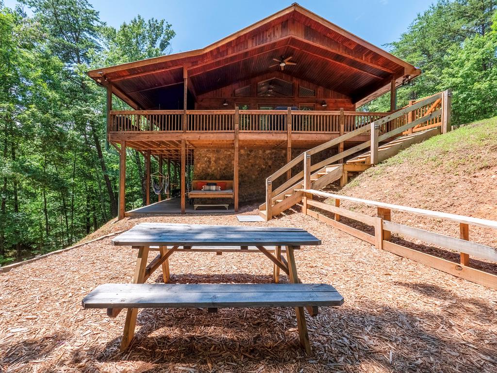 a roof deck with a table and chairs