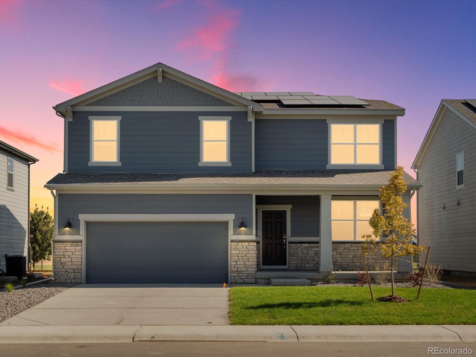 a front view of a house with a garage