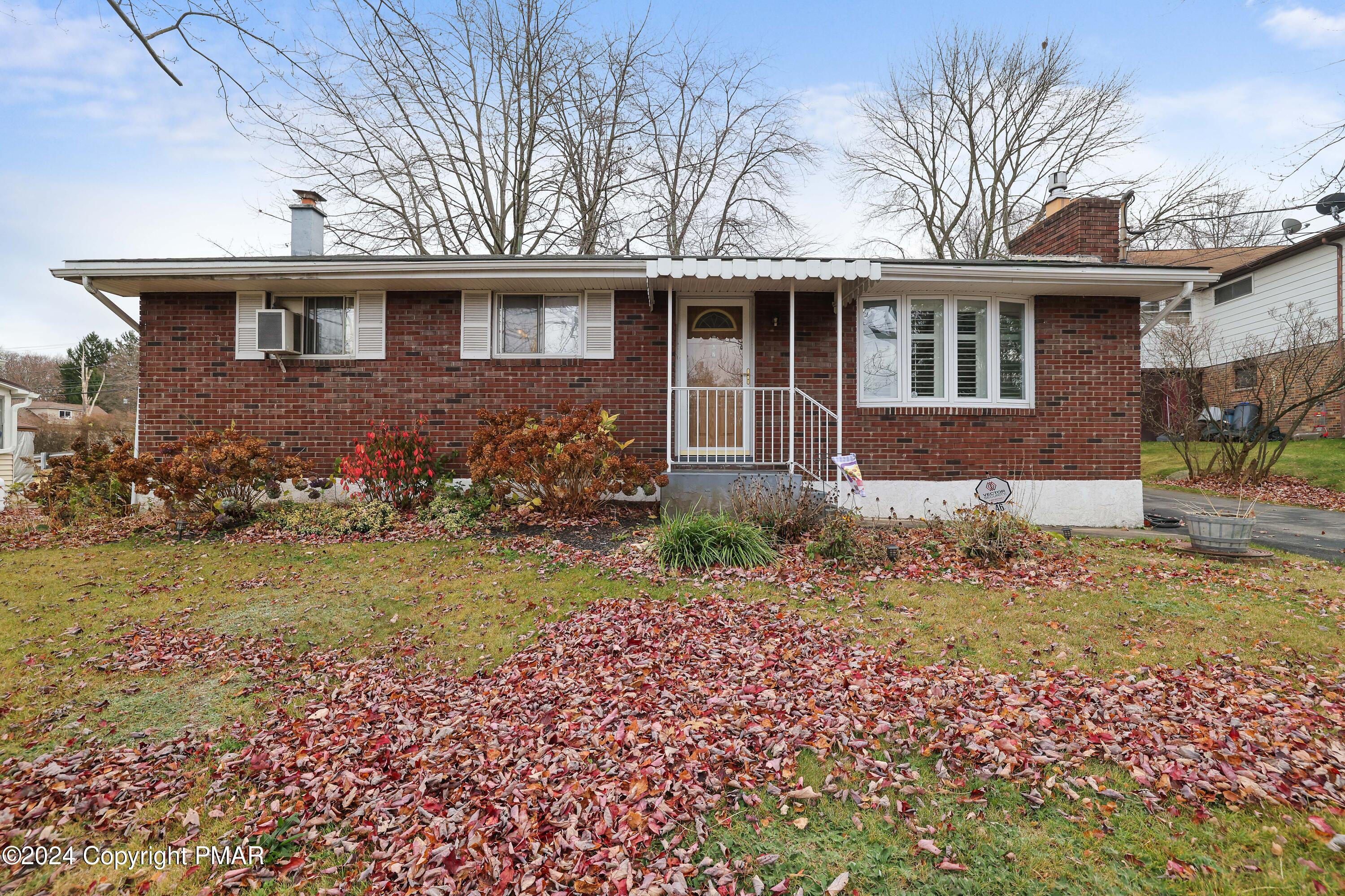 front view of a house with a yard