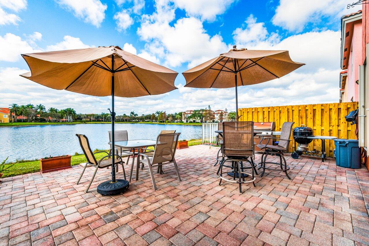 an outdoor space with furniture and umbrella