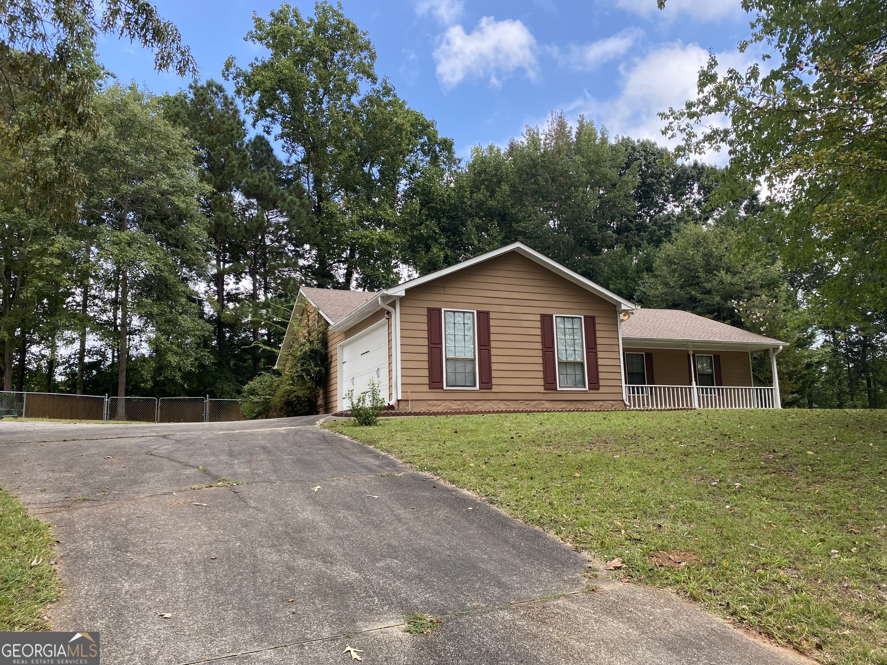 a front view of a house with yard