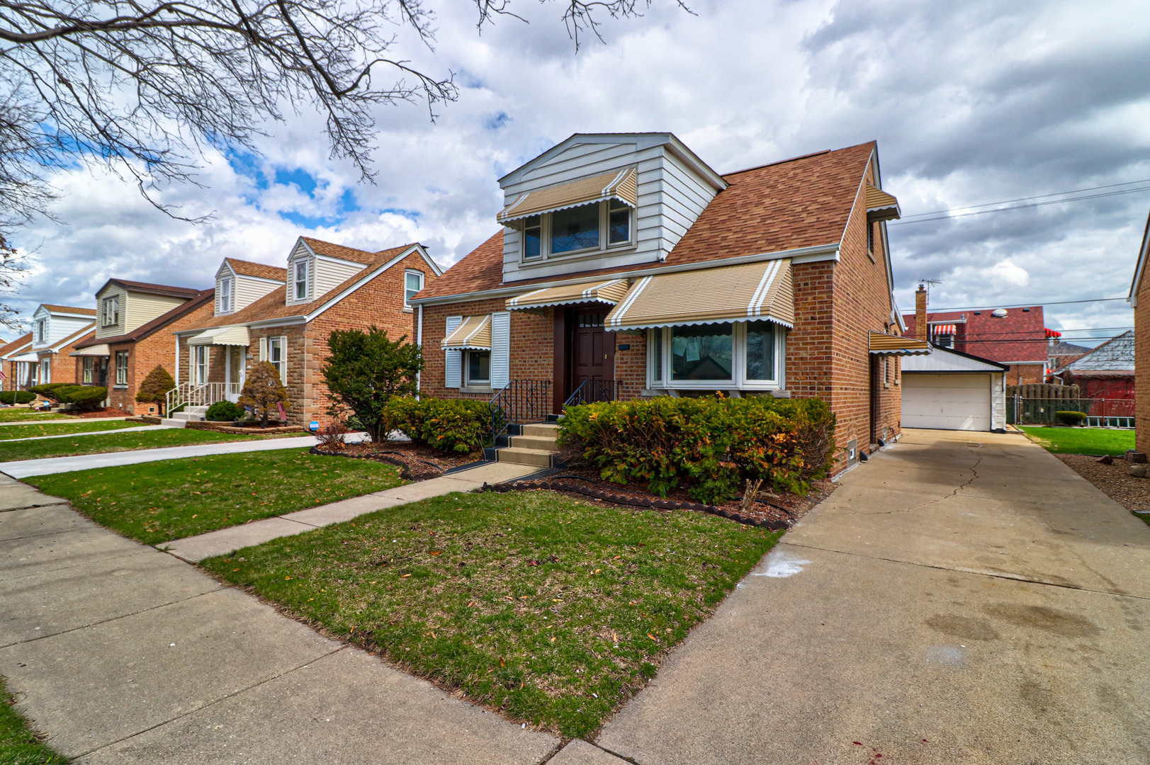 front view of a house with a yard