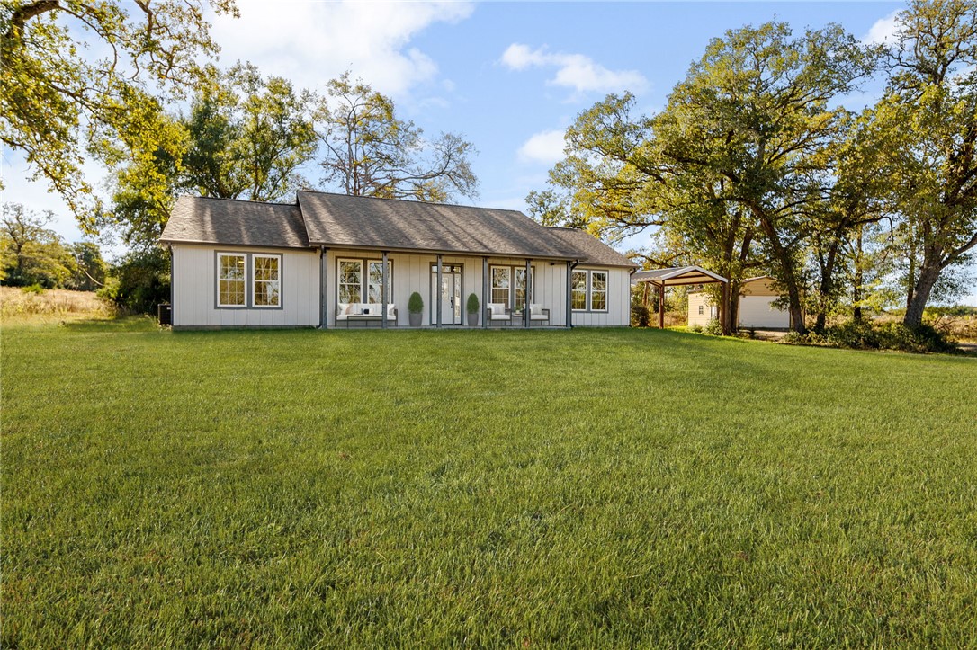 Ranch-style house featuring a front yard