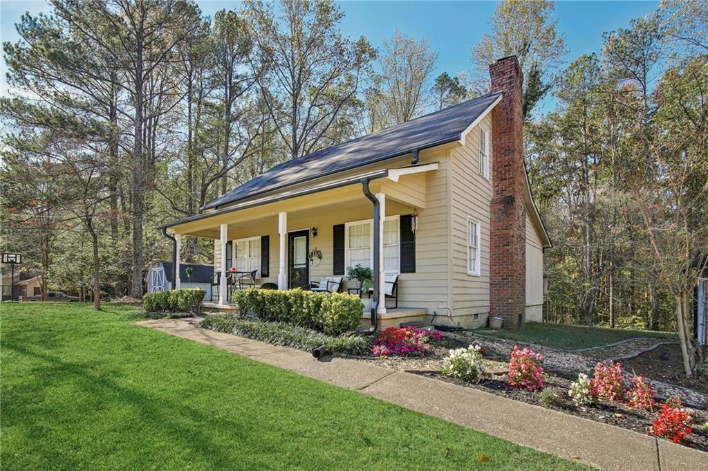 a view of a house with a garden