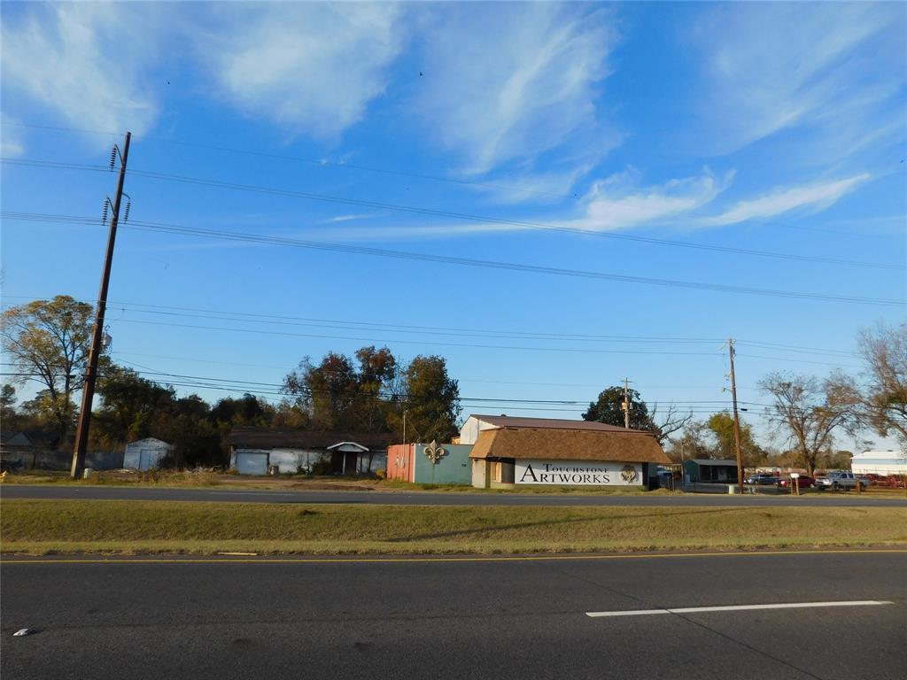 a view of a building in the background with a big yard