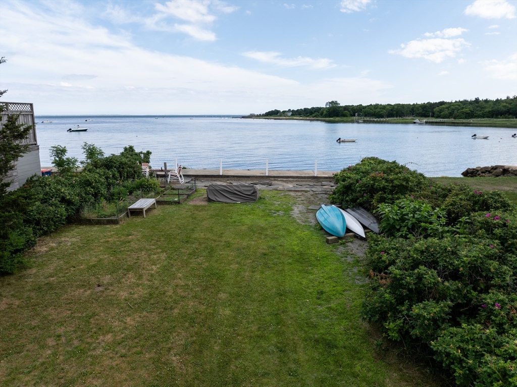 a view of a lake with houses in the back