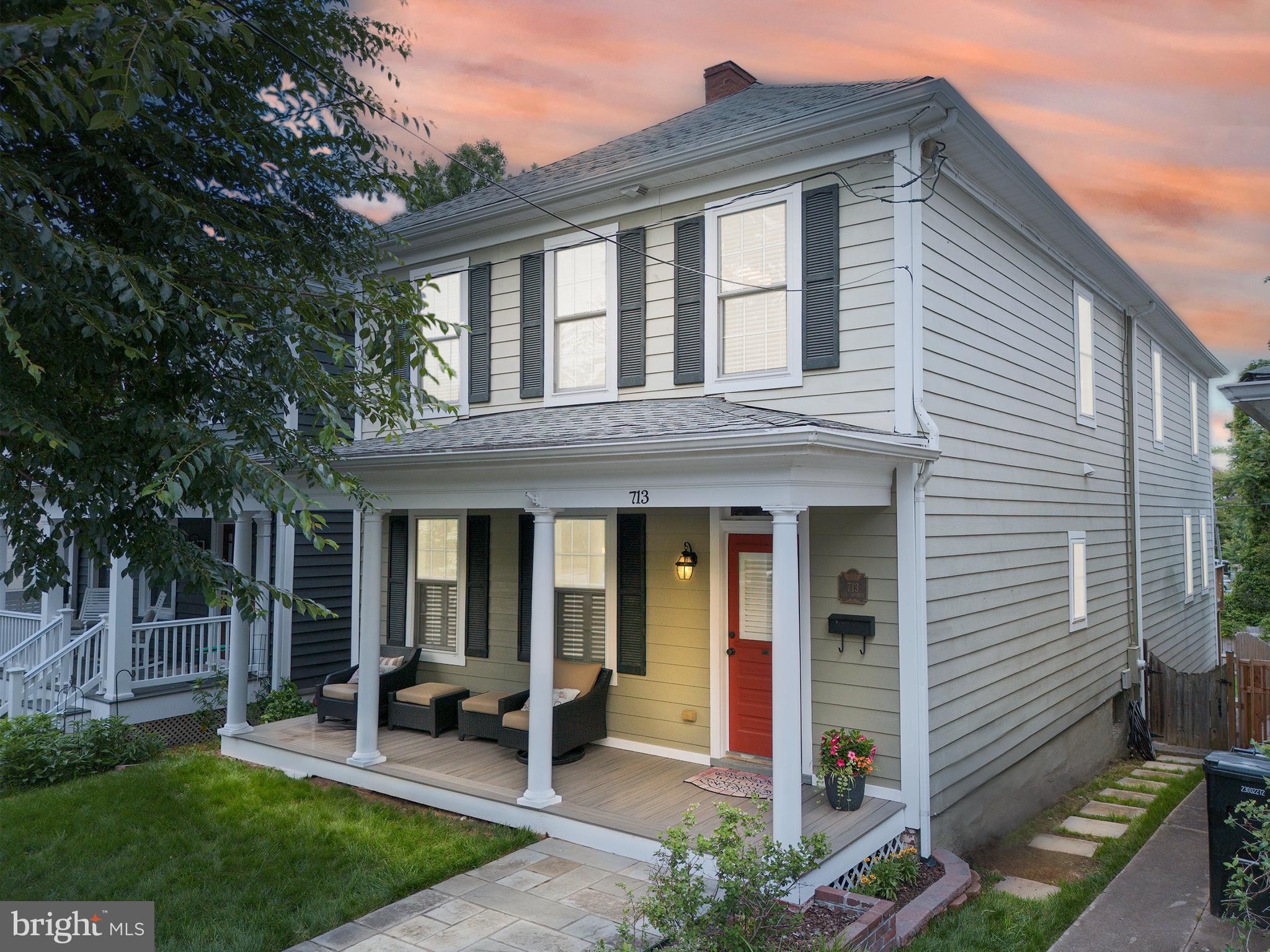 a front view of house with yard and outdoor seating