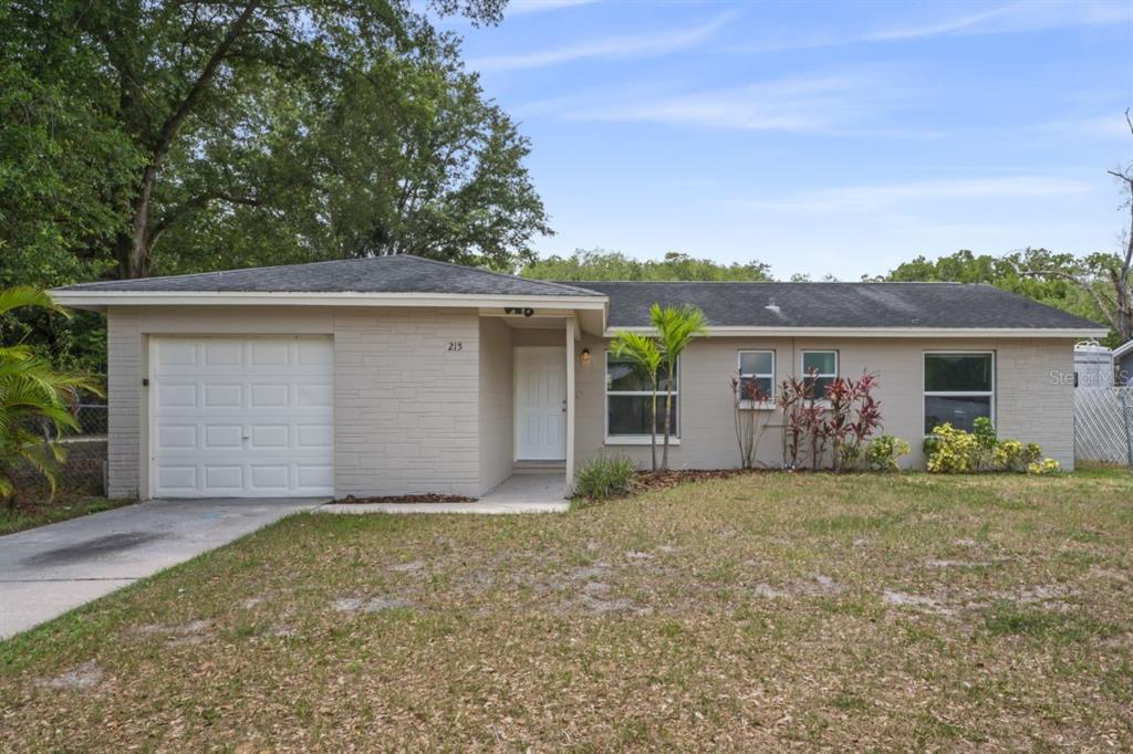 front view of a house with a yard