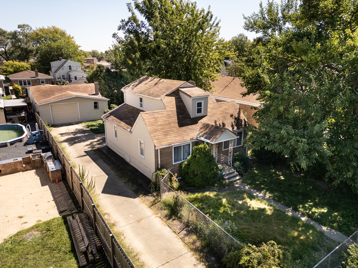 a view of a house with a yard from a balcony