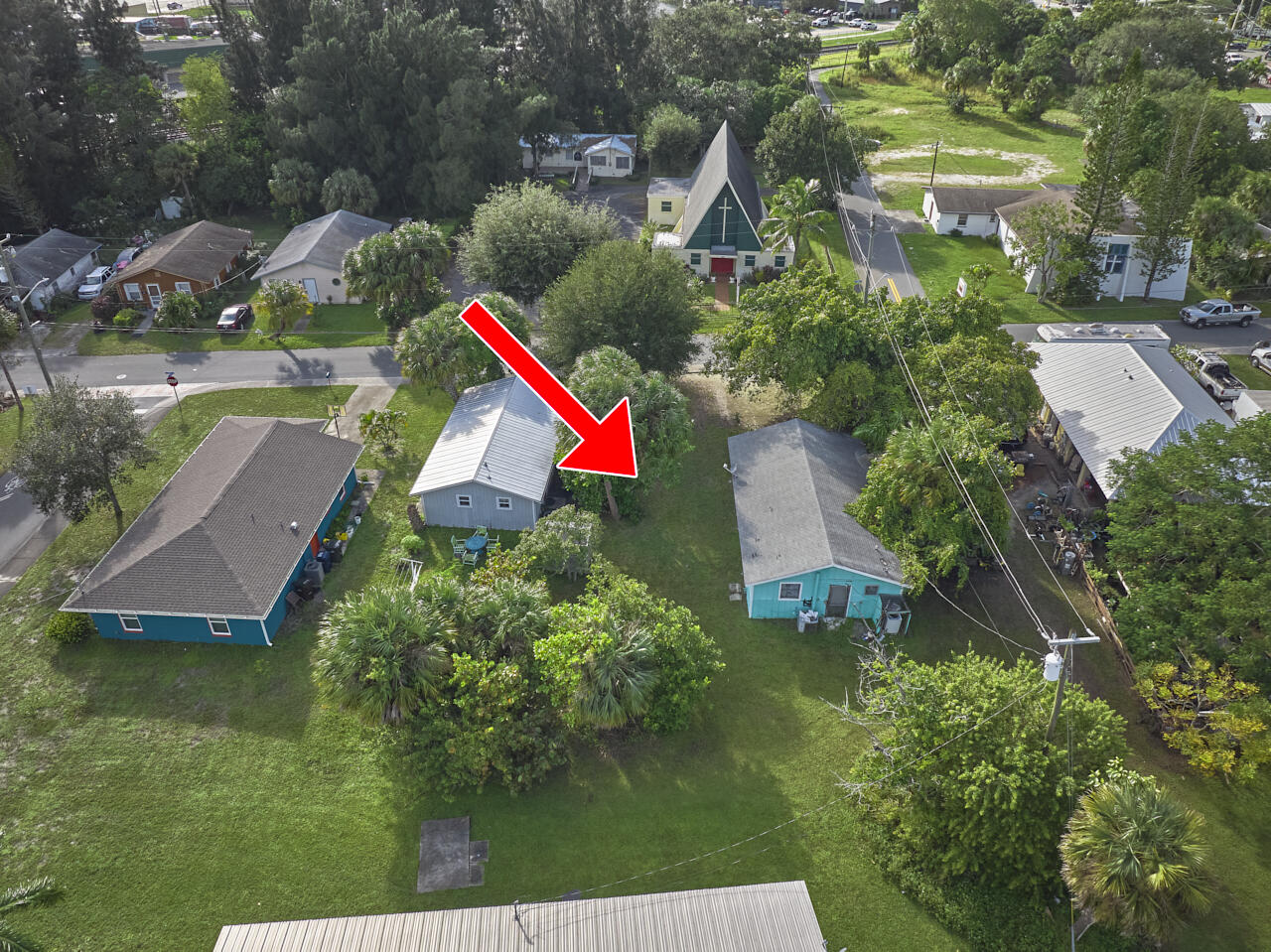 an aerial view of residential house with outdoor space and swimming pool