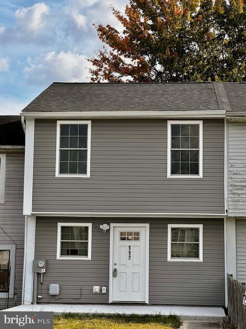 a front view of a house with garage