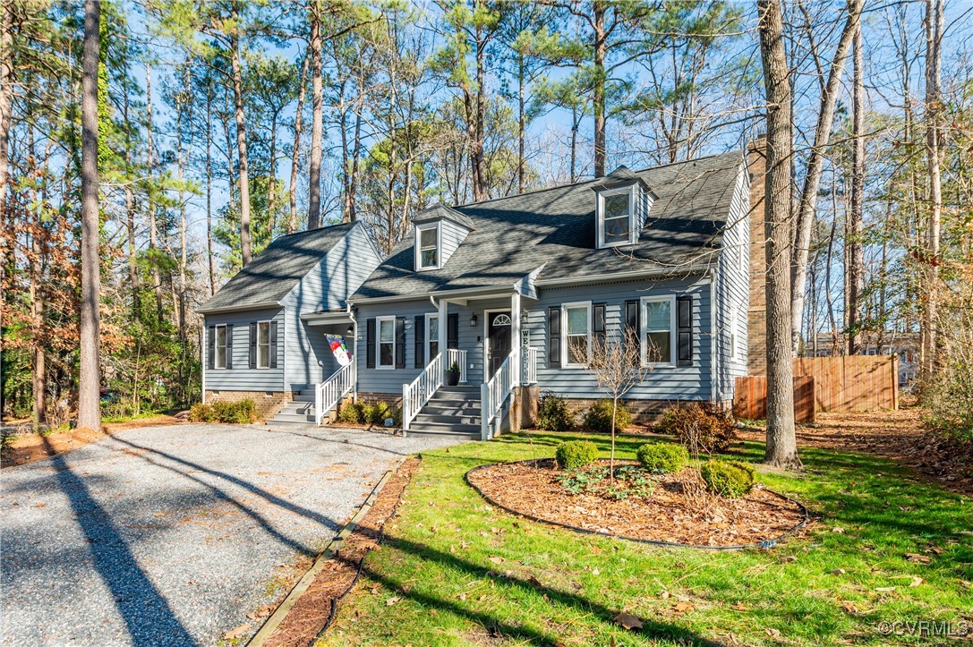 a view of a house with backyard porch and sitting area