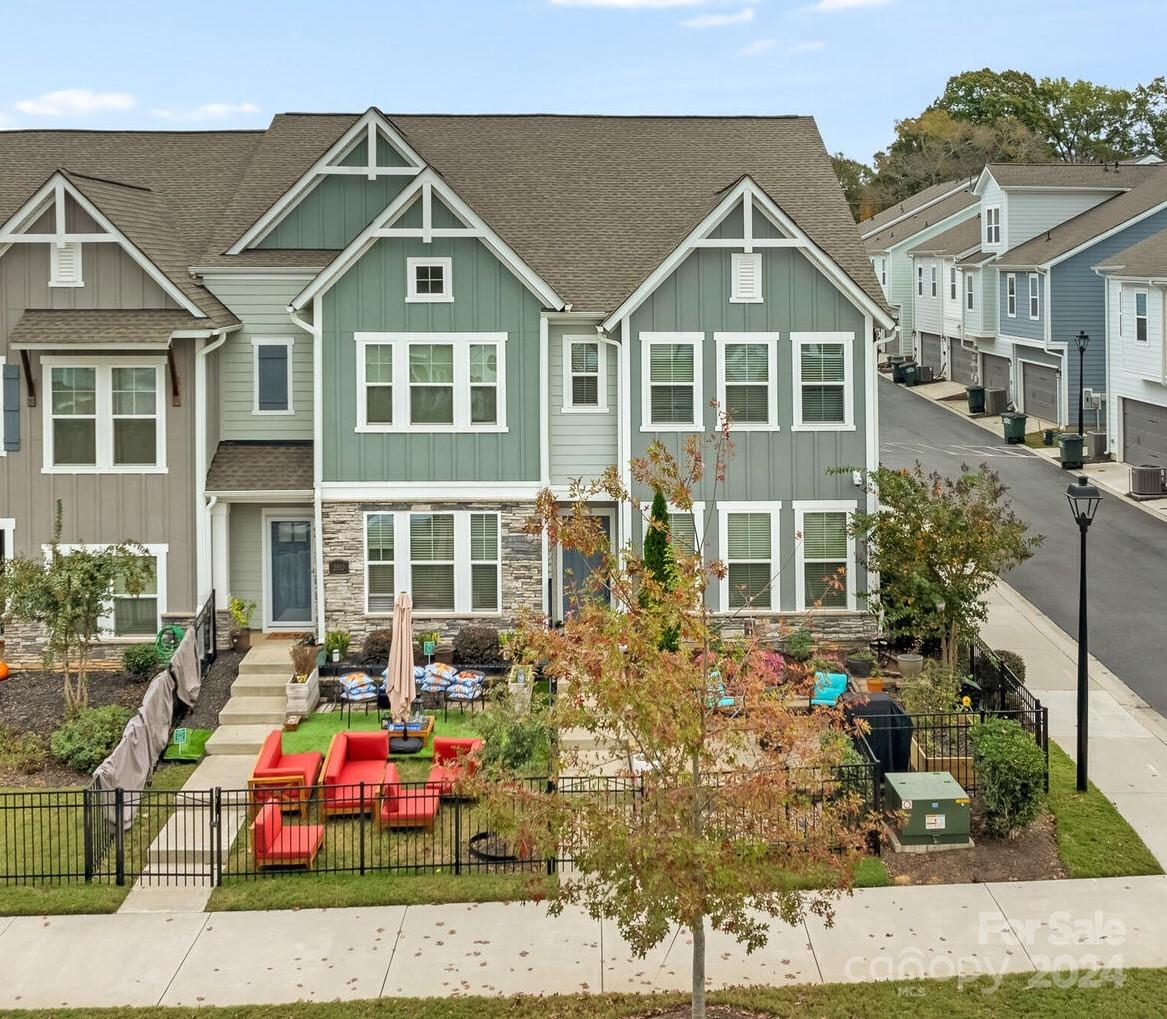 front view of a house with a bench