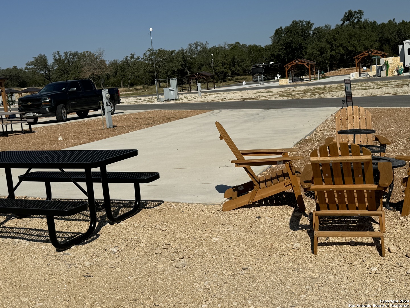 a swimming pool with outdoor seating and yard