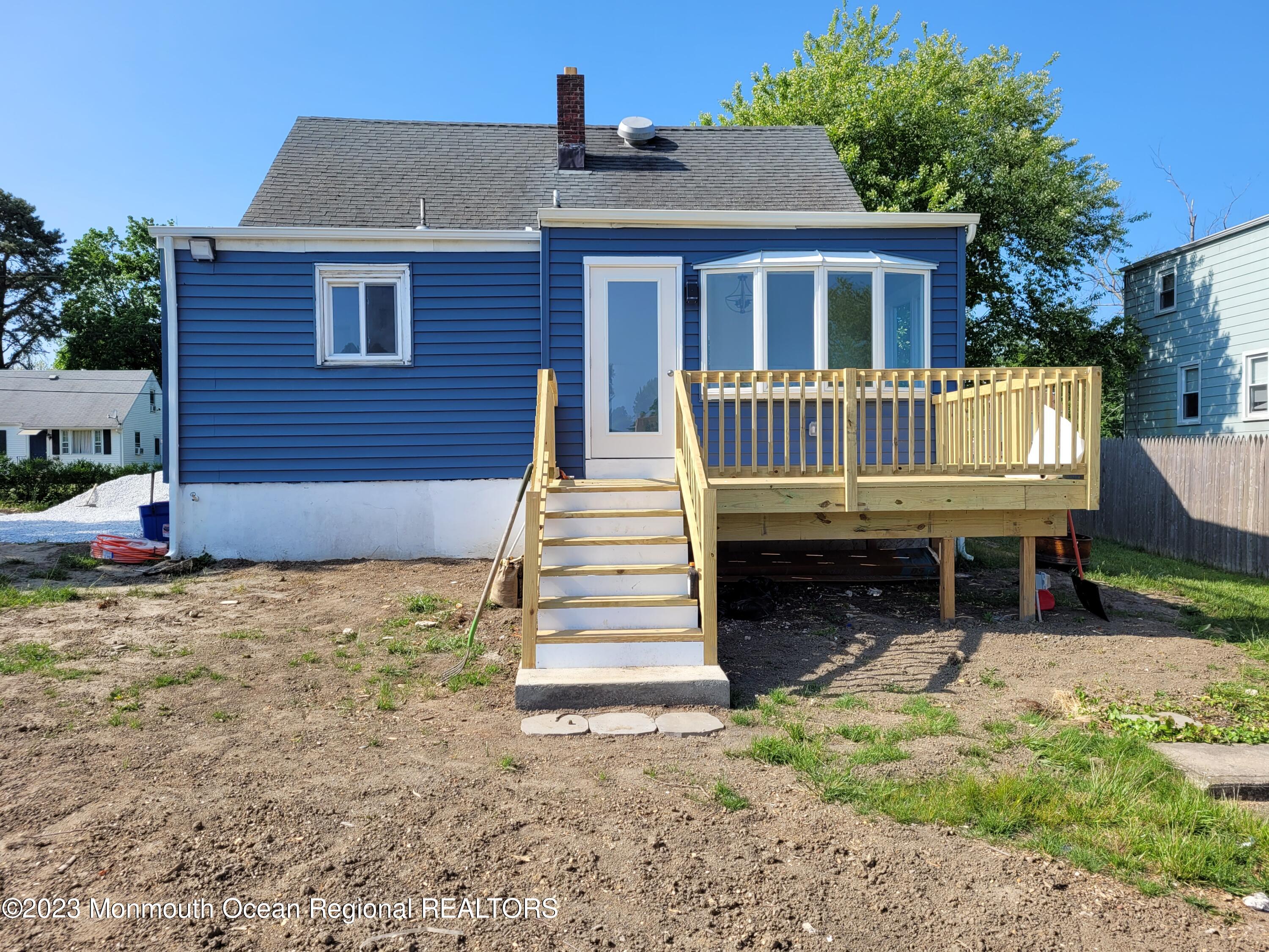 a backyard of a house with a deck