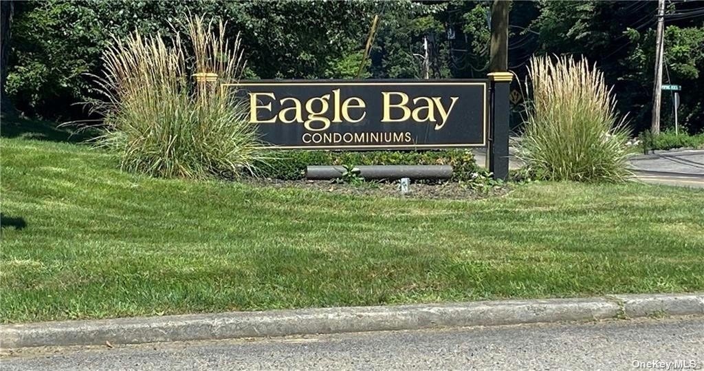 a sign broad in front of the red brick house