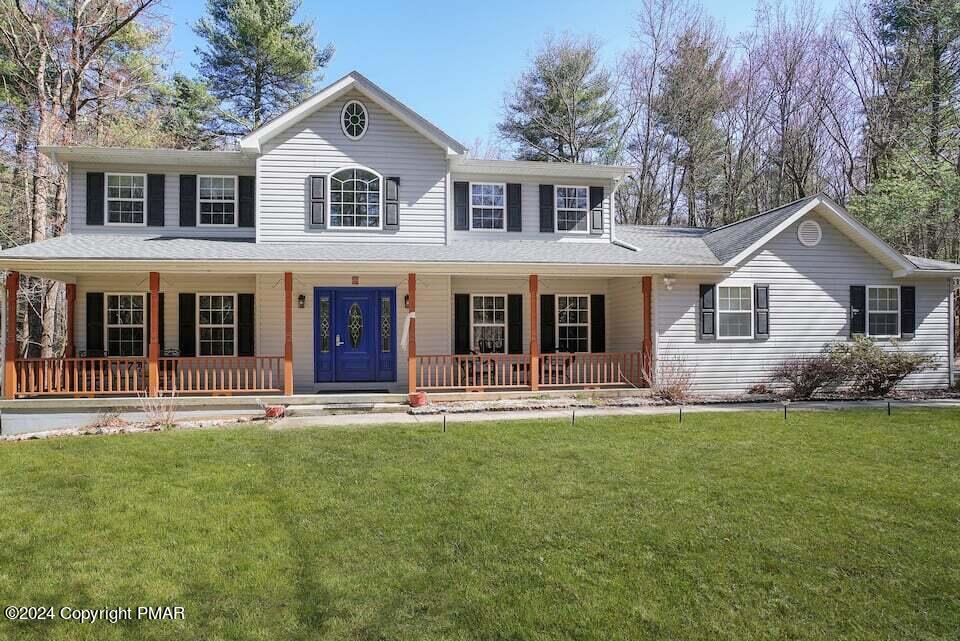 front view of a house with a yard